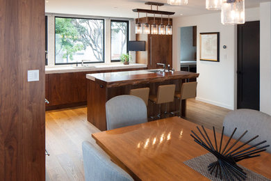Eat-in kitchen - large contemporary l-shaped eat-in kitchen idea in San Francisco with wood countertops