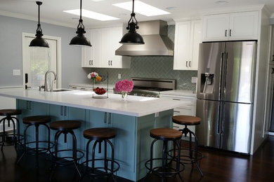 Mid-sized transitional l-shaped dark wood floor eat-in kitchen photo in San Francisco with an undermount sink, recessed-panel cabinets, white cabinets, quartz countertops, gray backsplash, porcelain backsplash, stainless steel appliances and an island