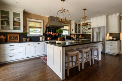 Transitional eat-in kitchen photo in San Francisco with shaker cabinets, white cabinets and an island