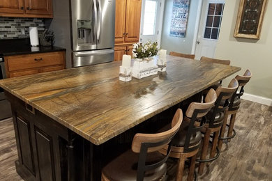 Kitchen - traditional kitchen idea in Louisville with quartzite countertops and brown countertops