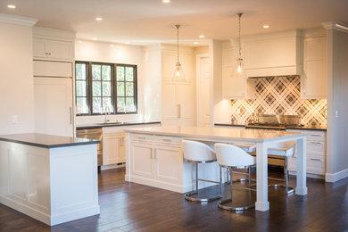 Example of a large transitional u-shaped dark wood floor eat-in kitchen design in San Francisco with an undermount sink, shaker cabinets, white cabinets, quartzite countertops, black backsplash, mosaic tile backsplash, paneled appliances and an island