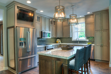 Example of a mid-sized trendy l-shaped eat-in kitchen design in Other with an undermount sink, recessed-panel cabinets, gray cabinets, quartzite countertops, ceramic backsplash, stainless steel appliances and an island