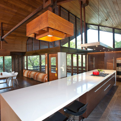 Inspiration for a large 1950s galley porcelain tile eat-in kitchen remodel in Cincinnati with a single-bowl sink, flat-panel cabinets, medium tone wood cabinets, quartz countertops, stainless steel appliances and an island