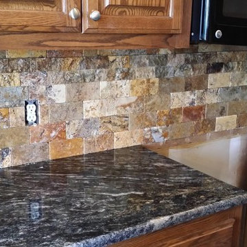Scabos Split face tile backsplash with Cordoba Granite Counte Top