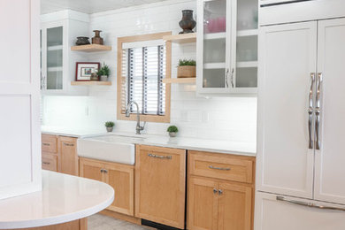 Danish galley ceramic tile and white floor open concept kitchen photo in Other with a farmhouse sink, shaker cabinets, light wood cabinets, quartz countertops, white backsplash, ceramic backsplash, paneled appliances, an island and white countertops