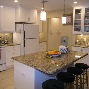 Design ideas for a mid-sized traditional u-shaped eat-in kitchen in Tampa with a double-bowl sink, shaker cabinets, white cabinets, granite benchtops, green splashback, matchstick tile splashback, stainless steel appliances, ceramic floors and with island.