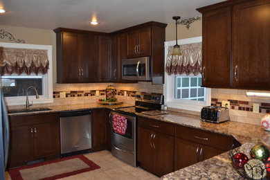 Example of a large transitional u-shaped ceramic tile eat-in kitchen design in Baltimore with an undermount sink, recessed-panel cabinets, dark wood cabinets, quartz countertops, multicolored backsplash, porcelain backsplash and stainless steel appliances