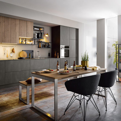 Inspiration for a contemporary single-wall gray floor eat-in kitchen remodel in Other with a drop-in sink, flat-panel cabinets, medium tone wood cabinets and beige backsplash