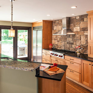 Design ideas for a mid-sized transitional kitchen pantry in Boston with shaker cabinets, medium wood cabinets, recycled glass benchtops, brown splashback and with island.