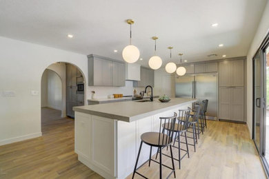 Inspiration for a large transitional open concept kitchen remodel in Phoenix with shaker cabinets and an island