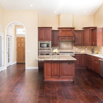 Expansive Kitchen Remodel with Starmark Cabinets and  Granite Top