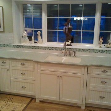 Sea Green Corian and White Cabinetry