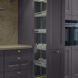 This is an example of a large eclectic l-shaped open plan kitchen in Other with a double-bowl sink, louvered cabinets, purple cabinets, quartz benchtops, beige splashback, stone slab splashback, coloured appliances, ceramic floors, a peninsula, beige floor and beige benchtop.