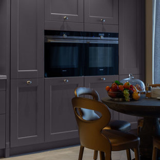 Inspiration for a large eclectic l-shaped open plan kitchen in Other with a double-bowl sink, louvered cabinets, purple cabinets, quartz benchtops, beige splashback, stone slab splashback, coloured appliances, ceramic floors, a peninsula, beige floor and beige benchtop.