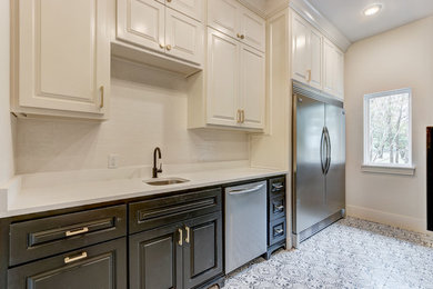 Example of a transitional kitchen pantry design in Oklahoma City with white countertops