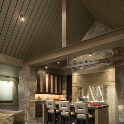 Example of a trendy open concept kitchen design in Seattle with glass-front cabinets, dark wood cabinets, metallic backsplash and metal backsplash