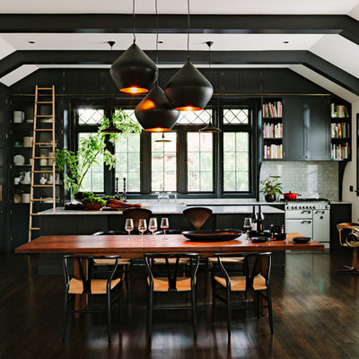 Example of a classic dark wood floor open concept kitchen design in Portland with shaker cabinets, gray cabinets, marble countertops, stone tile backsplash, paneled appliances, an island and black backsplash