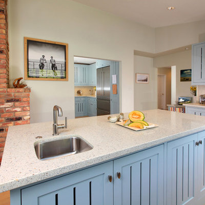 Example of a transitional kitchen design in Los Angeles with stainless steel appliances