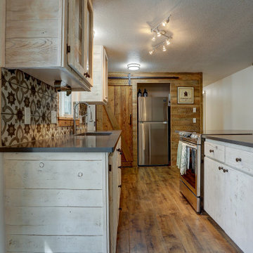 Shabby Chic Craftsman Kitchen with Sliding Barn Door