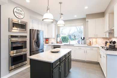 Example of a mid-sized transitional u-shaped porcelain tile and gray floor eat-in kitchen design in Dallas with an undermount sink, raised-panel cabinets, white cabinets, quartzite countertops, gray backsplash, stone tile backsplash, stainless steel appliances, an island and white countertops