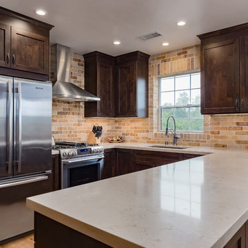 Shaker Dark Wood Cabinets and Stainless Steel Appliances in Kitchen Remodel