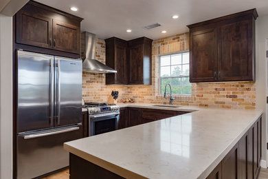 Shaker Dark Wood Cabinets and Stainless Steel Appliances in Kitchen Remodel