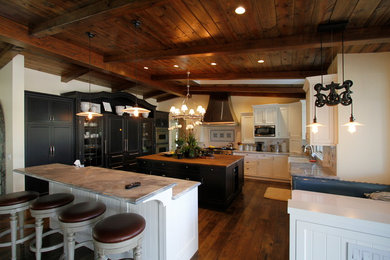 Kitchen photo with shaker cabinets and an island