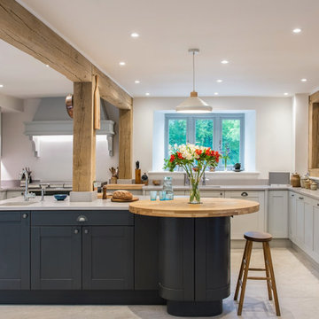 Shaker style kitchen in graphite & light grey with light quartz worktop & oak