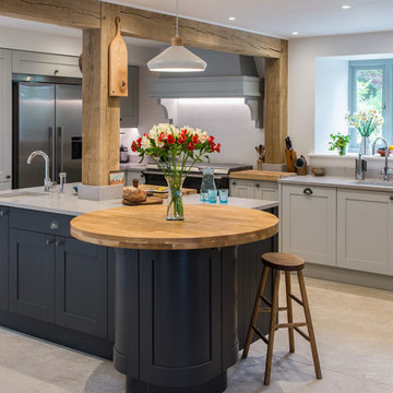 Shaker style kitchen in graphite & light grey with light quartz worktop & oak