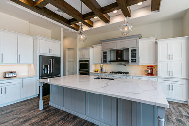 Large trendy l-shaped eat-in kitchen photo in Phoenix with an undermount sink, shaker cabinets, white cabinets and an island