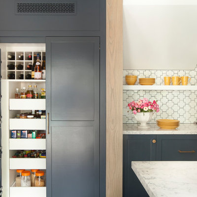 Example of a transitional kitchen pantry design in Los Angeles with shaker cabinets and white backsplash