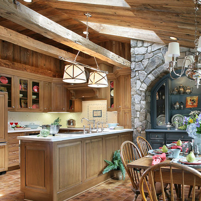 Large mountain style u-shaped medium tone wood floor eat-in kitchen photo in Las Vegas with paneled appliances, a drop-in sink, beaded inset cabinets, medium tone wood cabinets, white backsplash, ceramic backsplash and a peninsula