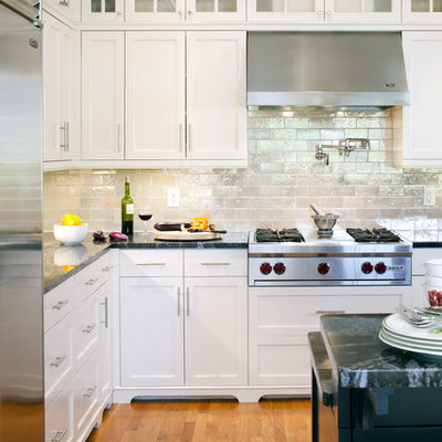 Inspiration for a victorian kitchen remodel in Boston with recessed-panel cabinets, stainless steel appliances, white cabinets, metallic backsplash and subway tile backsplash