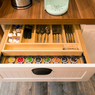 Design ideas for a mid-sized country kitchen pantry in Other with open cabinets, white cabinets, wood benchtops, porcelain floors, brown floor and brown benchtop.