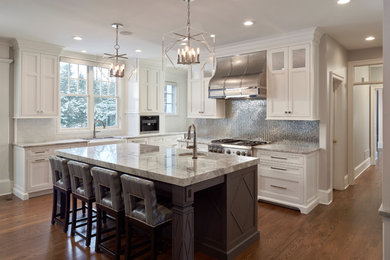 Inspiration for a large modern u-shaped dark wood floor open concept kitchen remodel in Philadelphia with a single-bowl sink, beaded inset cabinets, gray cabinets, quartzite countertops, white backsplash, cement tile backsplash and an island