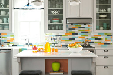 Transitional kitchen photo in Little Rock with gray cabinets, multicolored backsplash and glass-front cabinets