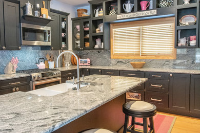 Silver Cloud granite kitchen with full height backsplash
