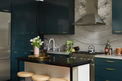 Eat-in kitchen - small contemporary l-shaped concrete floor and gray floor eat-in kitchen idea in Los Angeles with an undermount sink, flat-panel cabinets, blue cabinets, quartzite countertops, gray backsplash, stone slab backsplash, stainless steel appliances, an island and gray countertops