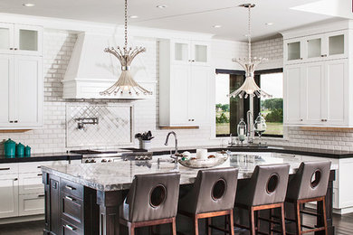 Eat-in kitchen - large transitional u-shaped dark wood floor eat-in kitchen idea in Denver with an undermount sink, shaker cabinets, white cabinets, marble countertops, white backsplash, subway tile backsplash, stainless steel appliances and an island