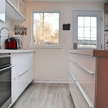 Single wall 18' IKEA kitchen with 6' island. RINGHULT high-gloss IKEA finish.
