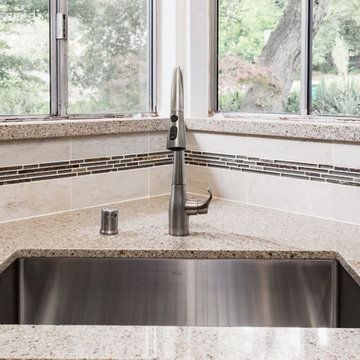 Sink in Corner of Large Countertop in Contemporary Kitchen