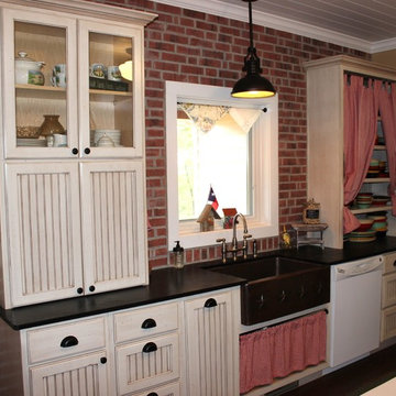 Sink Wall With Distressed Bead Board Cabinetry