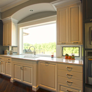 Sink Wall with Large Picture Window and Small Windows Under Cabinets