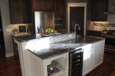 Danish eat-in kitchen photo in Minneapolis with granite countertops, an island and black countertops