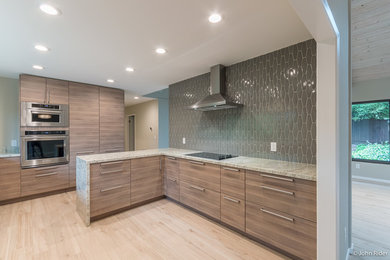 Enclosed kitchen - mid-sized contemporary l-shaped porcelain tile and beige floor enclosed kitchen idea in San Francisco with an undermount sink, flat-panel cabinets, gray cabinets, granite countertops, gray backsplash, ceramic backsplash, stainless steel appliances and a peninsula
