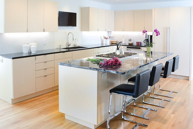 Example of a trendy kitchen design in Cleveland with an island