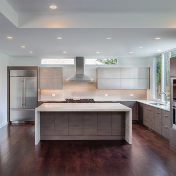Sleek contemporary kitchen with gray cabinetry