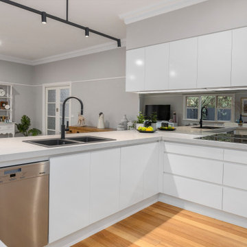 Sleek minimalist family kitchen in Ashburton
