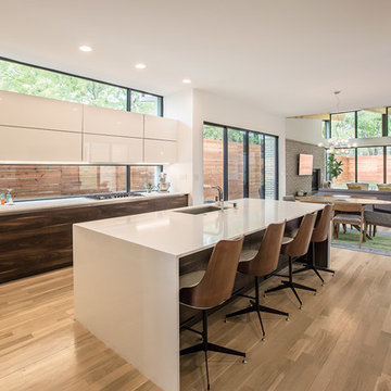 Sliding glass doors and clerestory windows combine to bring the outside in