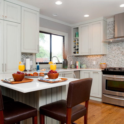 Inspiration for a timeless kitchen remodel in Miami with recessed-panel cabinets, multicolored backsplash, mosaic tile backsplash and stainless steel appliances